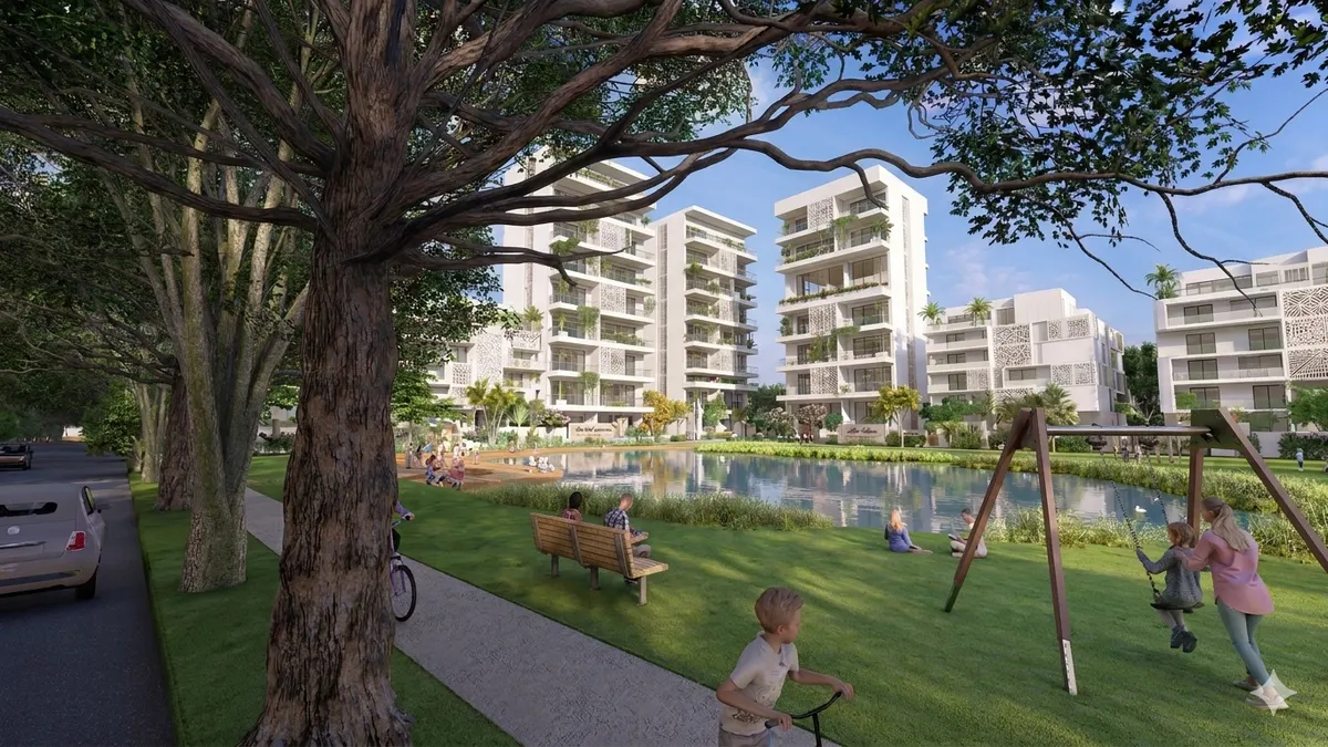 Visualisation of a residential masterplan around a park with a lake and play areas